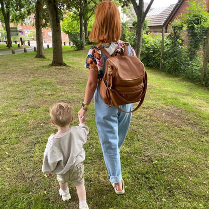 Bellaboo Mabel Baby Changing Bag Tan Worn as a Backpack With Mum And Son