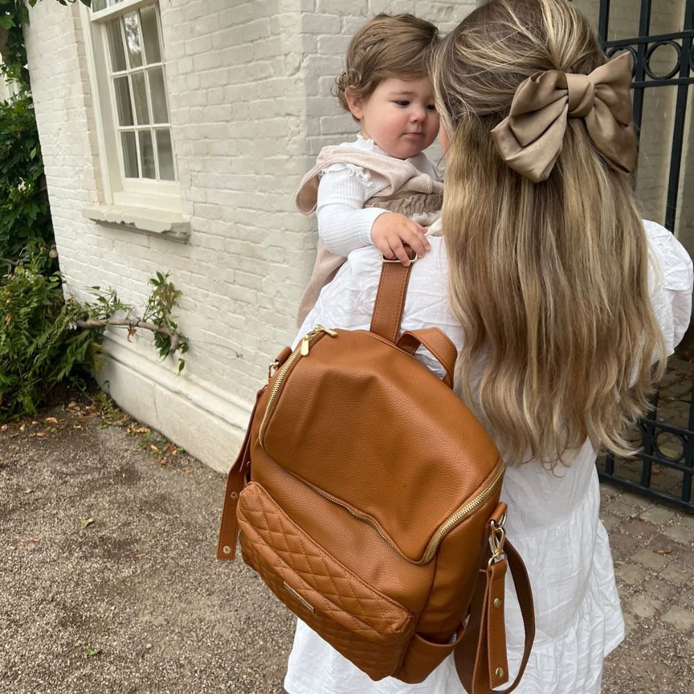 Bellaboo Mabel Baby Changing Bag Tan Worn On Shoulder With Mum And Daughter